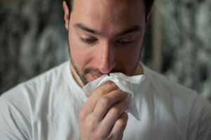 Picture of man sneezing