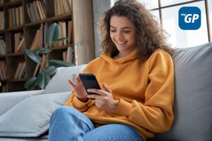 Lady looking at phone smiling